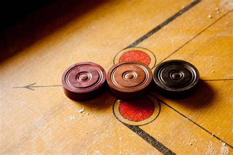 Free photo "Three Carrom Coins"