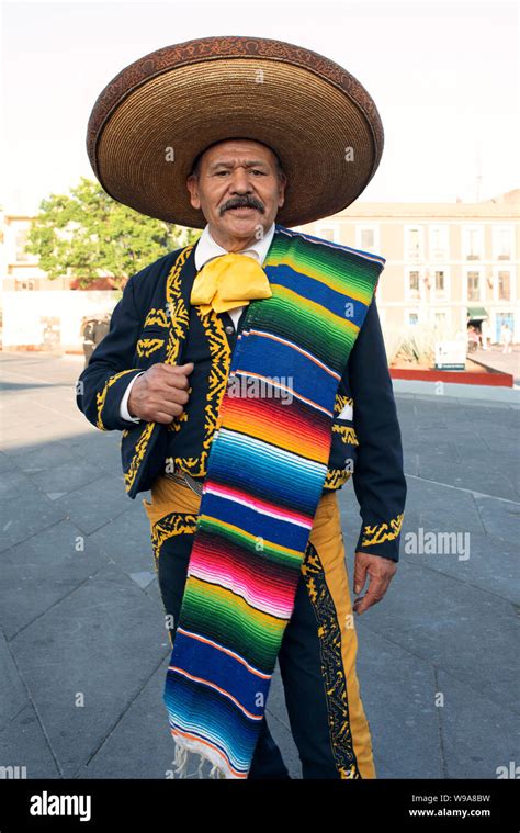 Mariachi (among many competitor mariachis) waiting to be hired for an ...