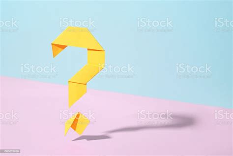 Floating Yellow Origami Question Mark On Bicolor Background Stock Photo ...