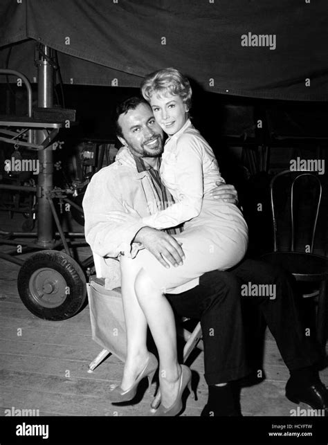 Barbara Eden, sitting on the lap of her first husband, actor Michael ...