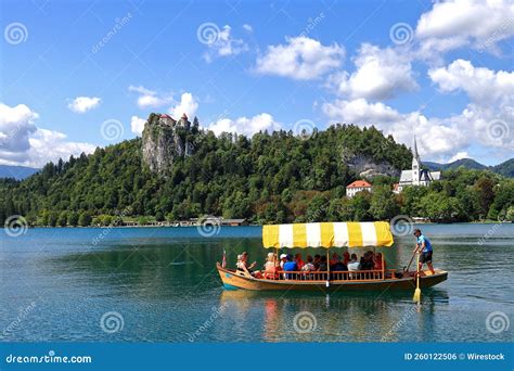 Wooden Boat Pletna at Lake Bled in Slovenia, with Medieval Bled Castle ...