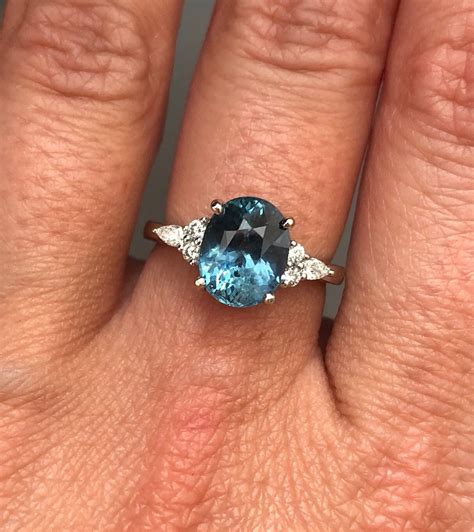 Teal sapphire engagement ring. Peacock green sapphire 3.1ct oval ...