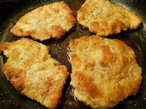 breaded wiener schnitzel with side dishes 24056081 Stock Photo at Vecteezy