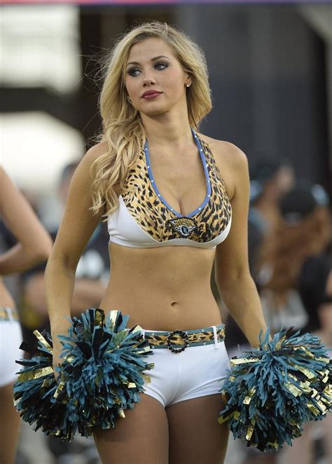 A Jacksonville Jaguar cheerleader performs during the first half of an ...