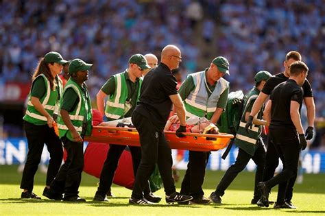 Luton captain Tom Lockyer collapses as match with Bournemouth abandoned ...