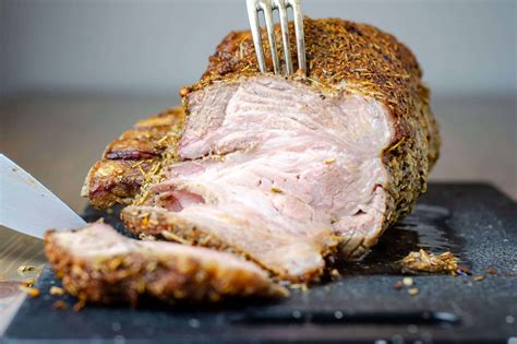 Easy Herb Crusted Bone in Pork Rib Roast with Au Jus - Yummy For Adam