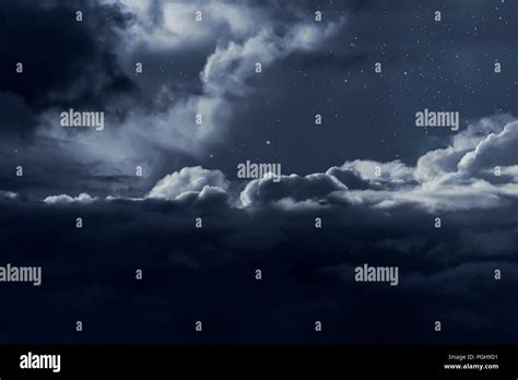 Dark cloudy night sky with stars Stock Photo - Alamy