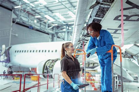 Female apprentice aircraft maintenance engineers in aircraft ...