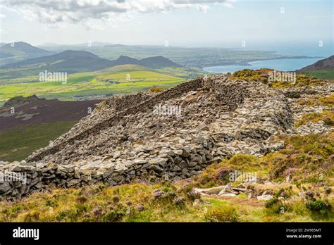 The walls to the Iron Age hill fort of Tre'r Ceiri on the Llyn ...