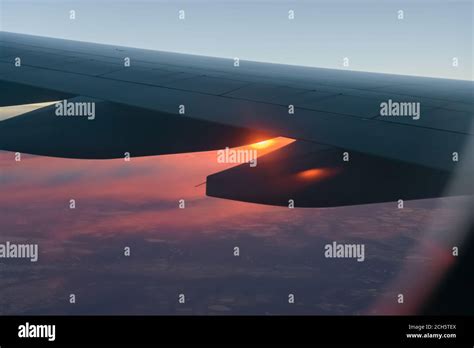 Wing of a airplane at sunrise at an altitude of 11 km Stock Photo - Alamy