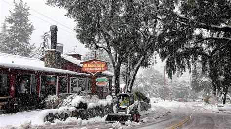 Rare snowfall in Southern California strands residents as another ...