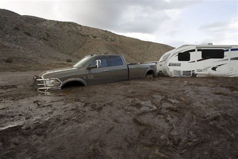 Dozens of vehicles are still stuck in the mud after flooding in ...