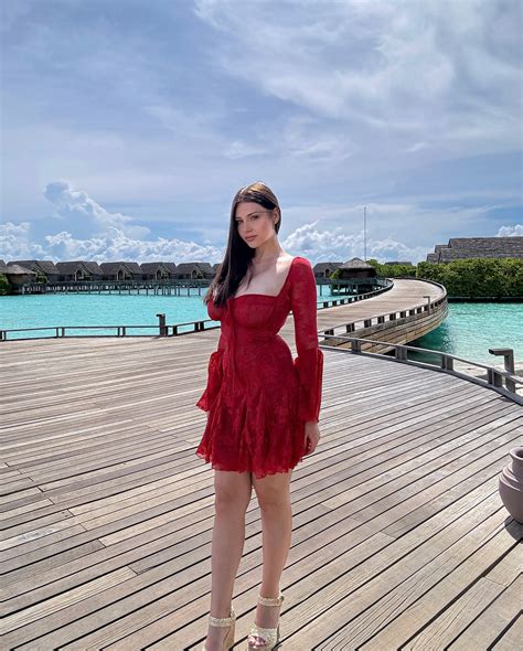 Andreea Mares Turns Heads in a Stylish Red Dress While Strolling in the ...