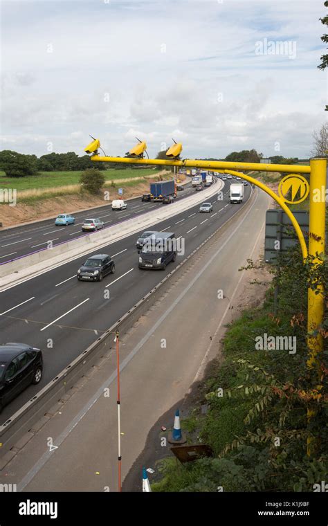 Average speed cameras on the M6 motorway in Cheshire,UK Stock Photo - Alamy