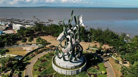 Aerial view of the A giant shark and crocodile statue as a symbol of ...