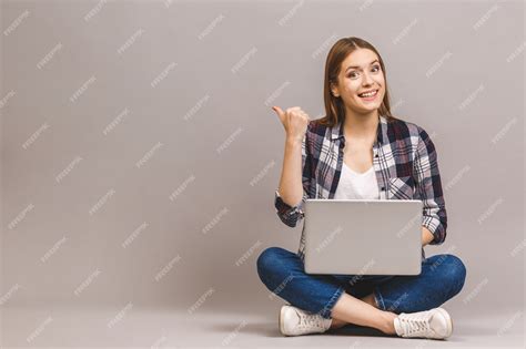 Premium Photo | Happy smiling woman working on laptop computer while ...