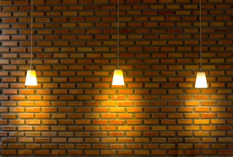 Brick wall illuminated by three lighting equipments 10098078 Stock ...