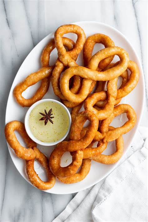 Cuban Bunuelos with Cinnamon-Anise Syrup - A Sassy Spoon