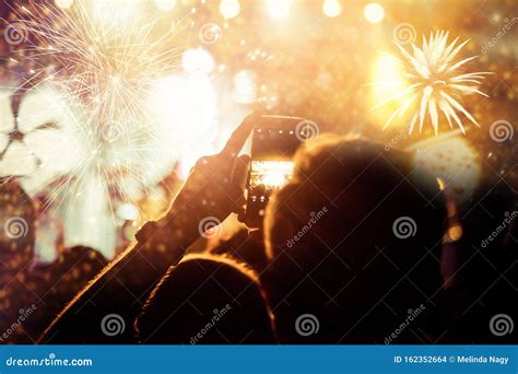 New Year Concept - Cheering Crowd and Fireworks Stock Photo - Image of ...