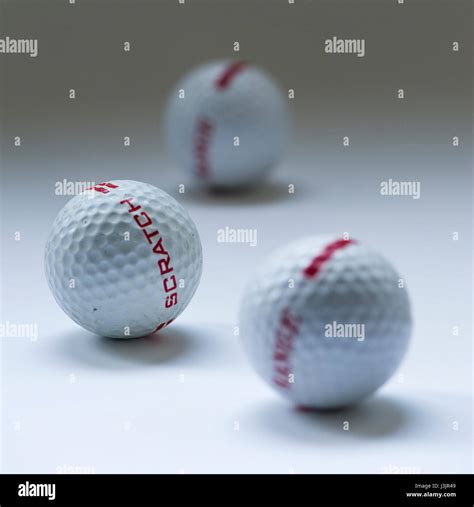 three golf balls Stock Photo - Alamy