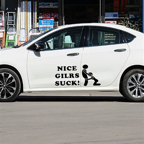 a white car parked in front of a store with a sticker on it's side