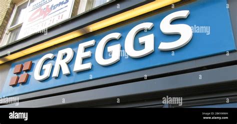 Greggs bakery logo at one of their store branches Stock Photo - Alamy