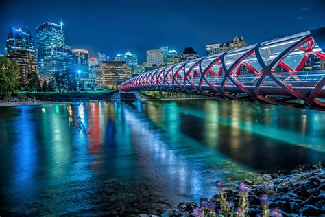 time lapsed photography of bridge with river, peace bridge, calgary ...