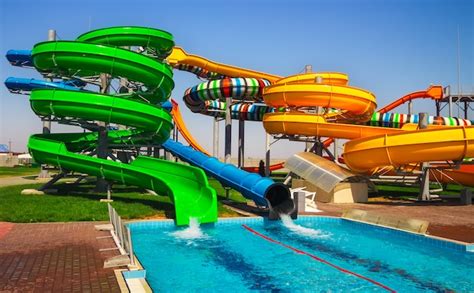 Premium Photo | Colorful aquapark slide with pool for everyone