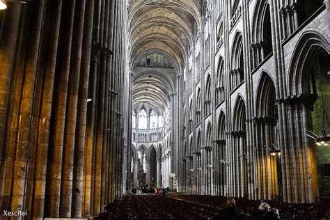 the inside of a large cathedral with many columns