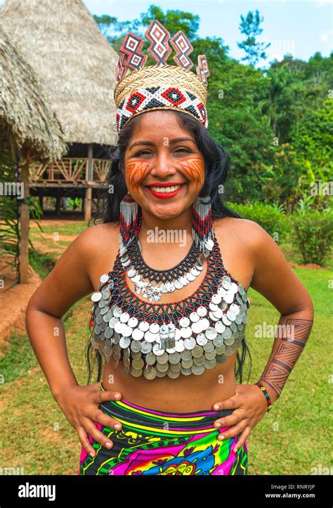 Portrait of a smiling Embera indigenous woman posing in front of ...