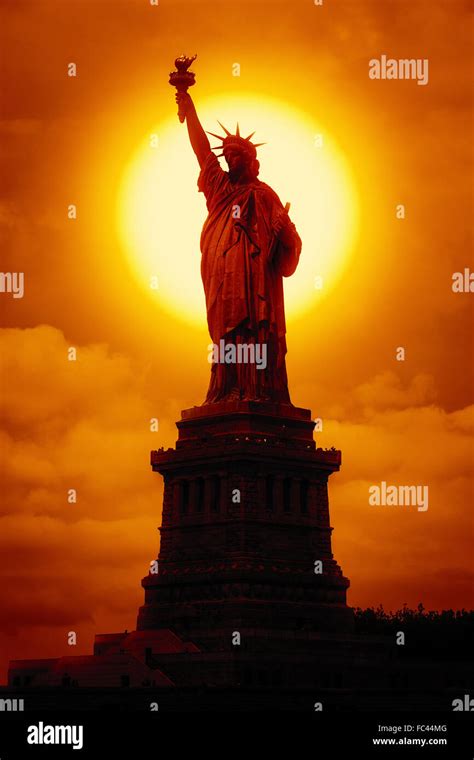 liberty statue at sunset Stock Photo - Alamy