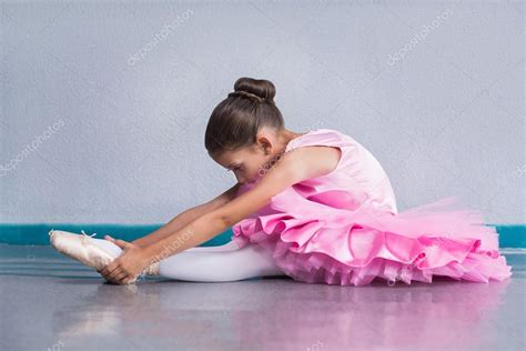 Young ballerina in a pink ballet tutu training in dance class Stock ...