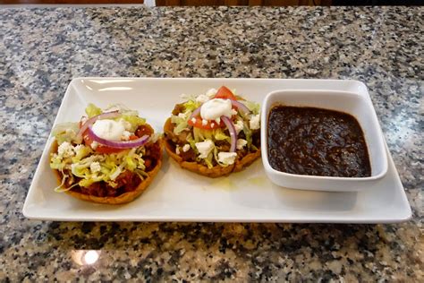 Mexican Sopes filled with Pork Rinds in Green Sauce and Meat and Potato ...