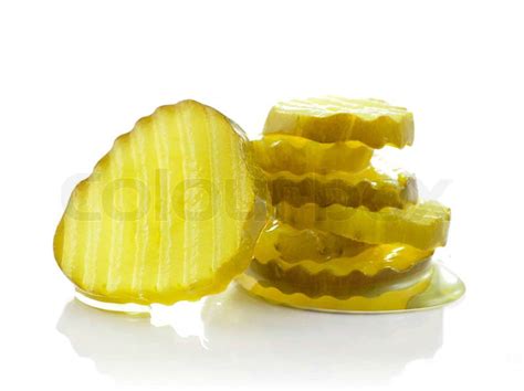 A stack of pickle slices on white background | Stock Photo | Colourbox