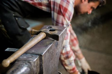 Premium Photo | The different tools lies on anvil at forge