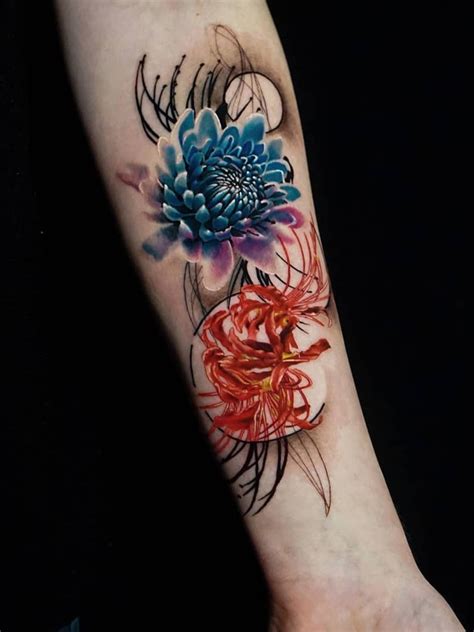 a colorful flower tattoo on the left forearm and hand, with an abstract ...