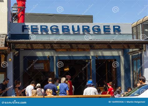 2016, February 14 - Queenstown, New Zealand, People in a Queue Waiting ...