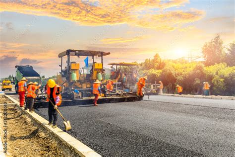 Construction site is laying new asphalt road pavement,road construction ...