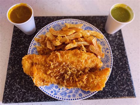 Proper fish & chips with scraps, curry and mushy peas. Tasted so good ...