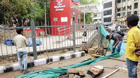 Pavement outside Greater Kailash Metro station caves in