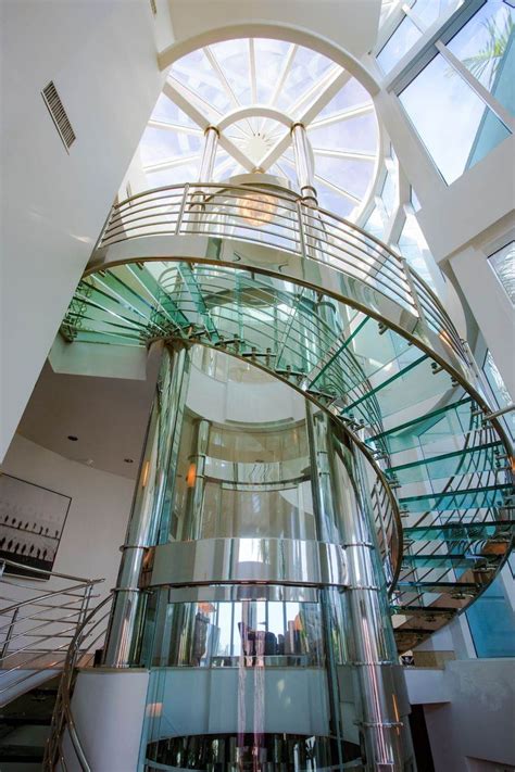 Florida beach pad with round glass elevator for $6M | Glass elevator ...