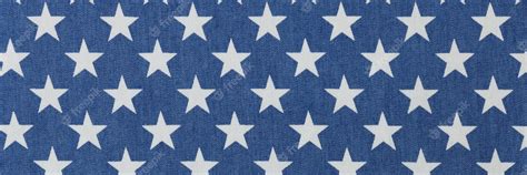 Premium Photo | Blue fabric with white stars texture background stars ...