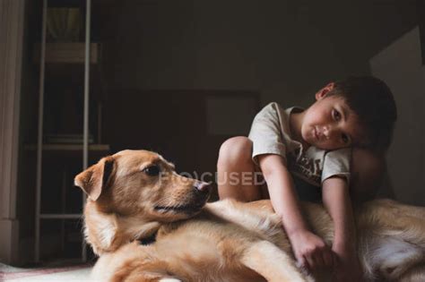 Adorable little boy hugging dog — hairy, lovely - Stock Photo | #120708262