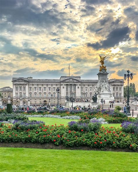 The gardens at Buckingham Palace in London, England under a beautiful ...