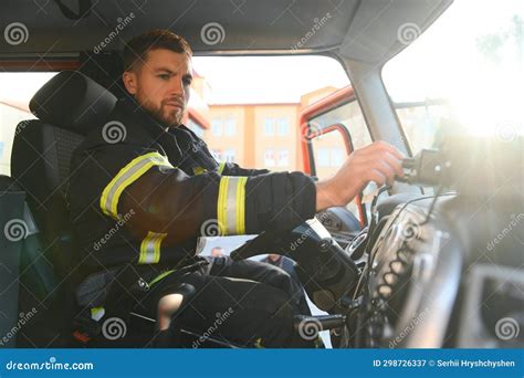 Firefighter Using Radio Set while Driving Fire Truck Stock Image ...