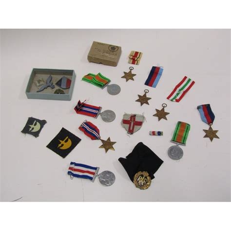 COLLECTION OF WORLD WAR II MEDALS AND BADGES, BUTTONS ETC