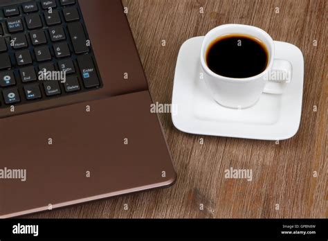 Espresso coffee with laptop Stock Photo - Alamy