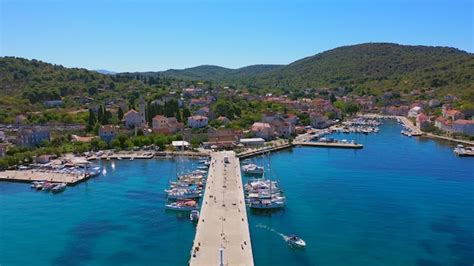 Premium Photo | Aerial view of harbor Boats and yachts docked in port