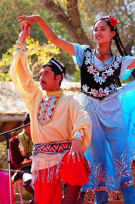 Uyghur dancers. A couple of Uyghur dancers at a local festival in ...