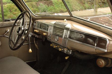 OLD PARKED CARS.: 1948 Plymouth Special Deluxe Sedan.